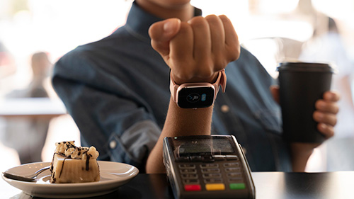 Person using smartwatch for payment